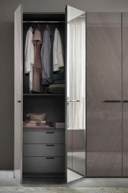 Minimalistic 4 door wardrobe in a soft gray tone.