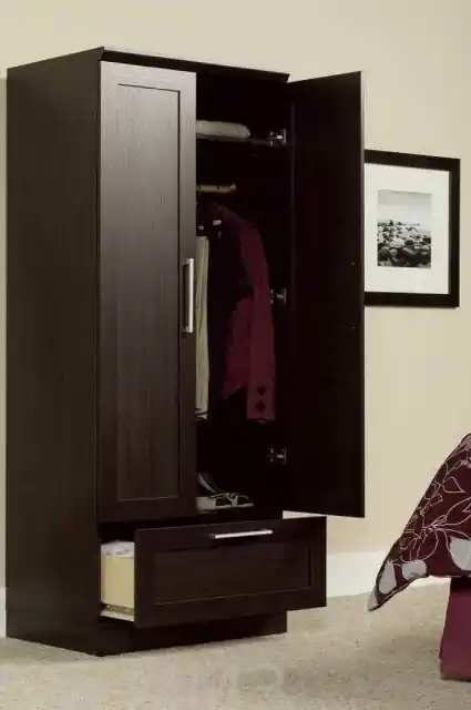 Spacious wardrobe cabinet with multiple compartments for organized storage.