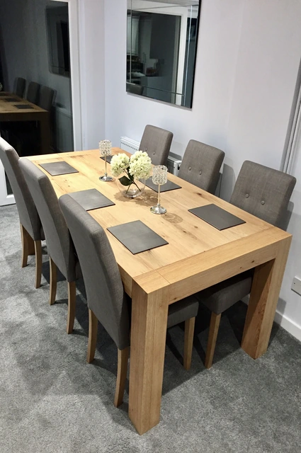 Dining Room with a Large Wooden Table and Grey Chairs