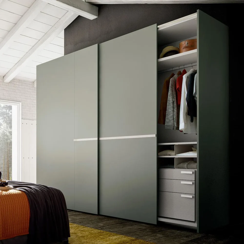 Minimalist wardrobe with white finish and simple pull-out drawers.
